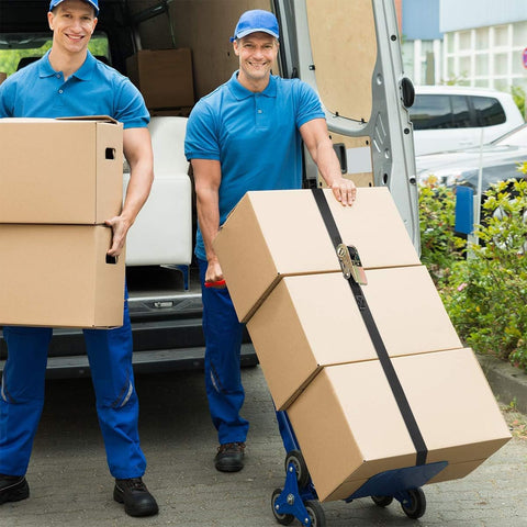 Workers securing boxes with Endless Ratchet Straps No Hook Nylon Tie Downs for Motorcycles and Kayaks on dolly, demonstrating use.