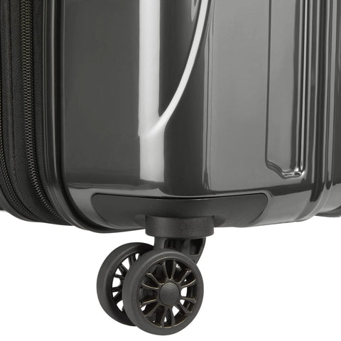 Bottom corner of brushed charcoal hardside luggage with dual spinner wheels