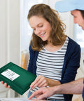 Woman holding an Ultramarine Green Bubble Mailers Set 6x10 Inch 25 Pack Self Sealing Padded Mailing Envelopes for Small Biz Shipping.