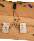 Hands On Circuit Board Kit For Young Experimenters Electrical Circuit Building Set displayed with components on a table