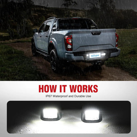 Rear License Plate Light Drop In For Nissan Frontier Navara D40 2007 Through 2021 And Titan Armada Xterra 2008 Through 2015 Suzuki Equator 2009 Through 2012 Black Housing OE Replacement 26510 Z Plug And Play Upgrade, shown installed on a truck in the rain highlighting waterproof feature.