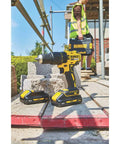 Heavy Duty 18V Cordless Hammer Drill Brushless Motor Kit With Two 3.0 Ah Lithium Ion Batteries and Compact Design on a construction site.