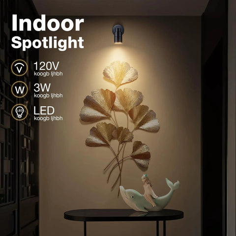 Two Pack Led Indoor Spotlight 120V 3W 3000K Warm White Uplight For Plants And Art illuminating a wall sculpture above a table