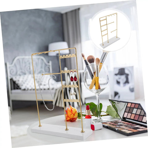 Spin Your Daily Drip Easily With This Smooth Rotating Jewelry Tree Stand Constructed From Premium Iron And Solid Marble For Necklaces And Earrings Storage in a modern room.