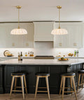Zobawlks Pendant Lights Kitchen Island: Mid-Century Hanging Light above black kitchen island with gold accents.