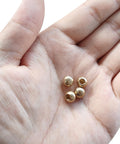Brass M4x0.7 Thread Cap Nuts 10 Pack No Tool Needed Screw Caps For Furniture And Lighting Decoration Ball Style Nut Covers in hand