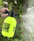 One Hand Operation Garden Sprayer With Adjustable Nozzle Half Gallon Handheld Portable Lawn Sprayer in use on plants