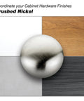 Brushed nickel cabinet handle on color-coordinating surface samples.