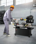 Worker using a Metal Horizontal Band Saw With 7 By 12 Inch Rectangular Cutting Capacity, Dual 110V To 220V Power