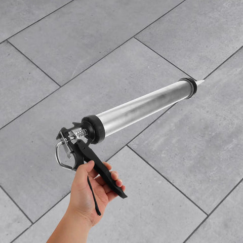 Built Tough As Nails Metal Caulk Smoothing Tool With Thick Reinforced Rod For Precision Sealant Bead Control Pro Finish in hand.