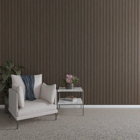 Top Shelf Solid Hardwood Adjustable Slat Wall Kit In Warm Walnut with slats installed in modern living space with chair and side table.