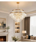 Luxury Gold K9 Crystal Chandelier Modern LED Pendant Light Energy Saving Lamp illuminating a stylish living room.