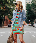 Woman wearing a Summer Sleeveless Round Neck Dress For Women With Pockets, Lightweight 95 Percent Polyester 5 Percent Spandex Blend, Wrinkle Resistant, Knee Length Casual Day Dress With Twin Side Pockets, with a denim jacket on a city street.