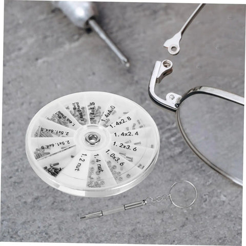 Eyeglass Repair Kit With Screws And Precision Screwdriver For Glasses Sunglasses And Watches The All In One Tool For Easy Quick Fixes At Home Or On The Go with arranged screws, glasses, and screwdriver on gray surface.