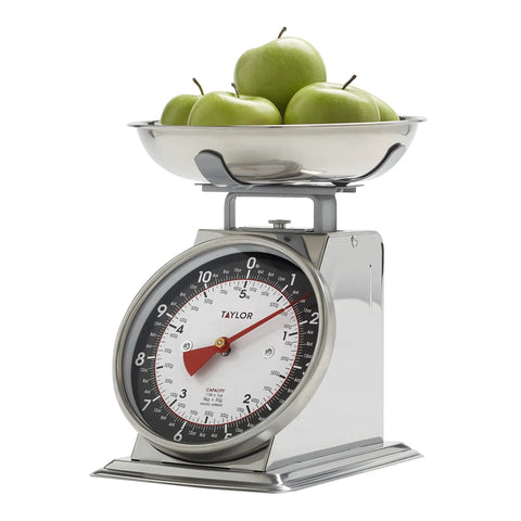 Analog Mechanical Kitchen Scale With Bowl Battery Free And Up To 11 Pounds Measuring In Grams And Ounces For Baking And Cooking Black And Silver showing apples in the bowl