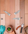 Go-To 2 Pack Stainless Steel Beekeeping Hive Tools Set on wooden background with gardening gloves and pruner, ideal for hive maintenance.