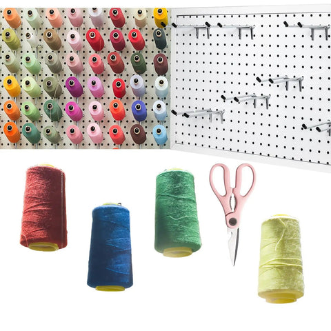 Colorful thread spools on pegboard with Badass Double Pegboard Hooks 15 Piece Set Crafted From Hella Tough Steel, scissors included.