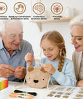 Child assembling Little Bear DIY Sewing Kit with grandparents, featuring plush bear bag and sewing accessories for beginners aged 6 to 12.