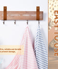 8 Piece Hella Durable Premium Leather Wall Hooks With Solid Brass Screws For Heavy Duty Curtain Hanging And Super Slick Bathroom Storage Essentials with hanging towels.