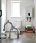 U Shape Drain Hose Holder For Washer And Dishwasher 2 Pack Gray Plastic Wall Mount Bracket in a modern bathroom setting.