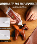 Precision tip application of Industrial Strength Leather Glue Adhesive Two 4.23 Oz Bottles Clear Flexible Bond shown on leather toy