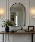 Wireless Wall Sconces with Remote Control, 10000mAh Battery Operated Wall Sconce Set of 2, Brushed Nickel lighted above a console table.