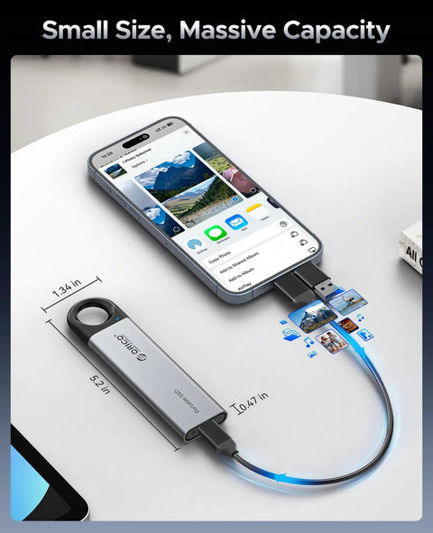 512GB Portable SSD With 460MB/s Speed, Hook Design External Drive connected to smartphone via USB-C next to desktop