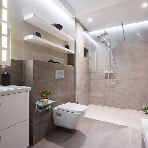Modern bathroom featuring anti rust toilet paper holder with shelf and phone storage rack in frosted silvery steel finish.