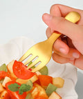 Two Piece Colorful Compact Fork And Spoon Set For Travel Camping And Picnics, Durable Stainless Steel Cutlery With Easy Grip in use.