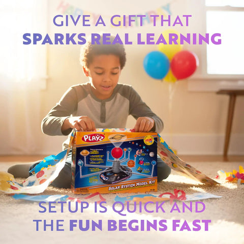 Child opening Epic Solar System Model Kit For Kids With 4 Speed Motor And HD Planetarium Projector. Gift wrap on the floor.