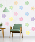 Spring Flower Wall Stickers Set With 16 Pastel Danish Aesthetic Floral Decals on a dorm wall with green chair and lamp.