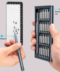 Top Notch 25 In 1 Precision Screwdriver Set With Magnetic Bits For Glasses Phones Smart Watches And Laptops Heavy Duty Steel Mini Repair Kit in hand with magnetic storage box.
