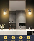 Over Mirror Bathroom Light Fixture One Light Brushed Nickel Wall Sconce in bathroom setting with mirror and glass globe shade.