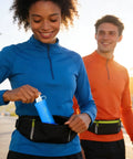 Woman with Foldable Water Bottle Soft Portable Leakproof Folding Pouch For Active Mobility, placing in waist pack while jogging.