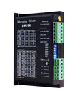 Front view of DM556 CNC microstep driver module, black enclosure with green terminal blocks.