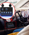 Waterproof 5 Gang Rocker Switch Panel With Aluminum Body For 12V To 24V Boats Cars RVs And Trucks Includes Dual USB Socket Volt Meter And Bright Blue LED Indicator Beefed Up Marine Grade Construction Easy DIY Install mounted on boat dashboard with steering wheel in view.