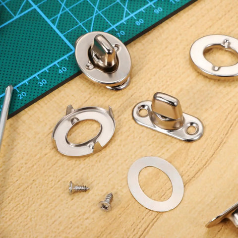Premium Heavy Duty Marine Turn Button Fasteners Twist Lock Studs and screws on a work surface for securing canvas boat covers.