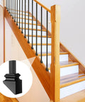 Set Of 40 Iron Baluster Shoes With Flat And Slant Options For 45 Degree Stairs Includes Screws Fits Half Inch Square Balusters Ideal For Indoor Outdoor Railings Rust Resistant Black Finish Durable And Easy To Install shown installed on wooden staircase with black balusters.