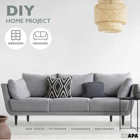Gray sofa with black and white pillows, featuring heavy duty black 16 inch tapered wooden furniture feet replacement legs.