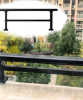 Level Up Your Outdoor Setup With This Super Sturdy Steel Balcony Railing Height Extender and Adjustable Patio Guard for Heavy Duty Deck Protection and Zero Hassle Install, black railing with flat top.