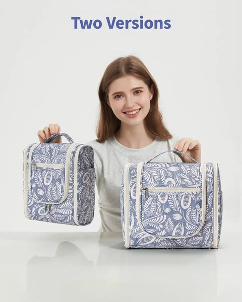 Smiling woman holding two sizes of Hanging Toiletry Bag For Travel Makeup Organizer Unisex On The Go Large Capacity With 8 Mesh Pockets Blue Leaf Pattern