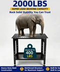 Heavy Duty Steel Welding Table 2000 Lbs Capacity 36 By 24 Workbench With 5/8 Fixture Holes And Tool Tray Built Like A Tank For The Daily Grind with an elephant on top.