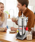 Couple in kitchen with Electric Grain Mill Grinder 750g Capacity High Speed 2000W Commercial Pulverizer on a wooden counter
