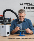 Man using Desktop Solder Fume Extractor With Low Noise 50 DB 160 Cubic Meters Per Hour Strong Suction Pro Grade HEPA Filter