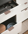 Image of Finger Edge Pulls Self-Adhesive 8 Pack Concealed Cabinet Drawer Handles Modern Curved Aluminum Alloy, brown, installed on white drawers.