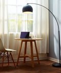 Arc Floor Lamp With Faux Black Marble Base And Black Bell Shade beside table in living room, mid-century modern vibe, 78 inch cord