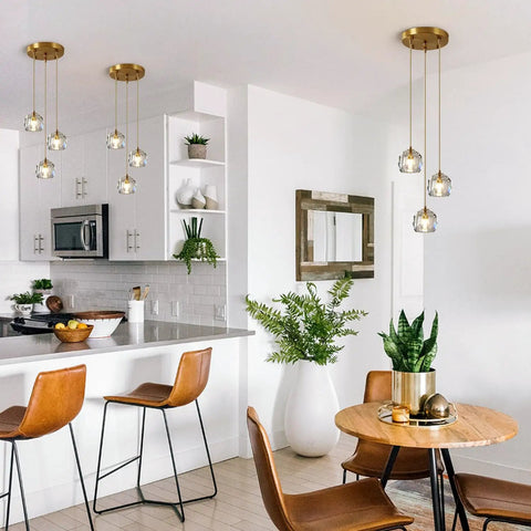 Three Light Crystal Cluster Pendant Chandelier In Gold Finish in kitchen dining area with modern décor.