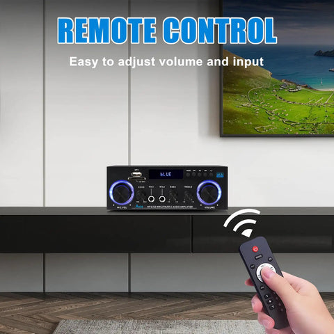 Person using remote control with AK50 Amplifier For Home Audio With Bluetooth 5.0 Big Room Filling Sound And Crisp Bass 500W Max Power