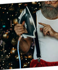 Man holding iron with High Temperature Steam Hose For Steam Irons, Heavy Duty High Pressure Flexible Steam Tube attached