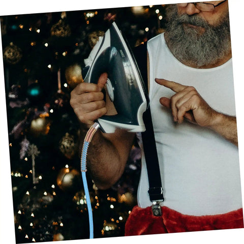 Man holding iron with High Temperature Steam Hose For Steam Irons, Heavy Duty High Pressure Flexible Steam Tube attached
